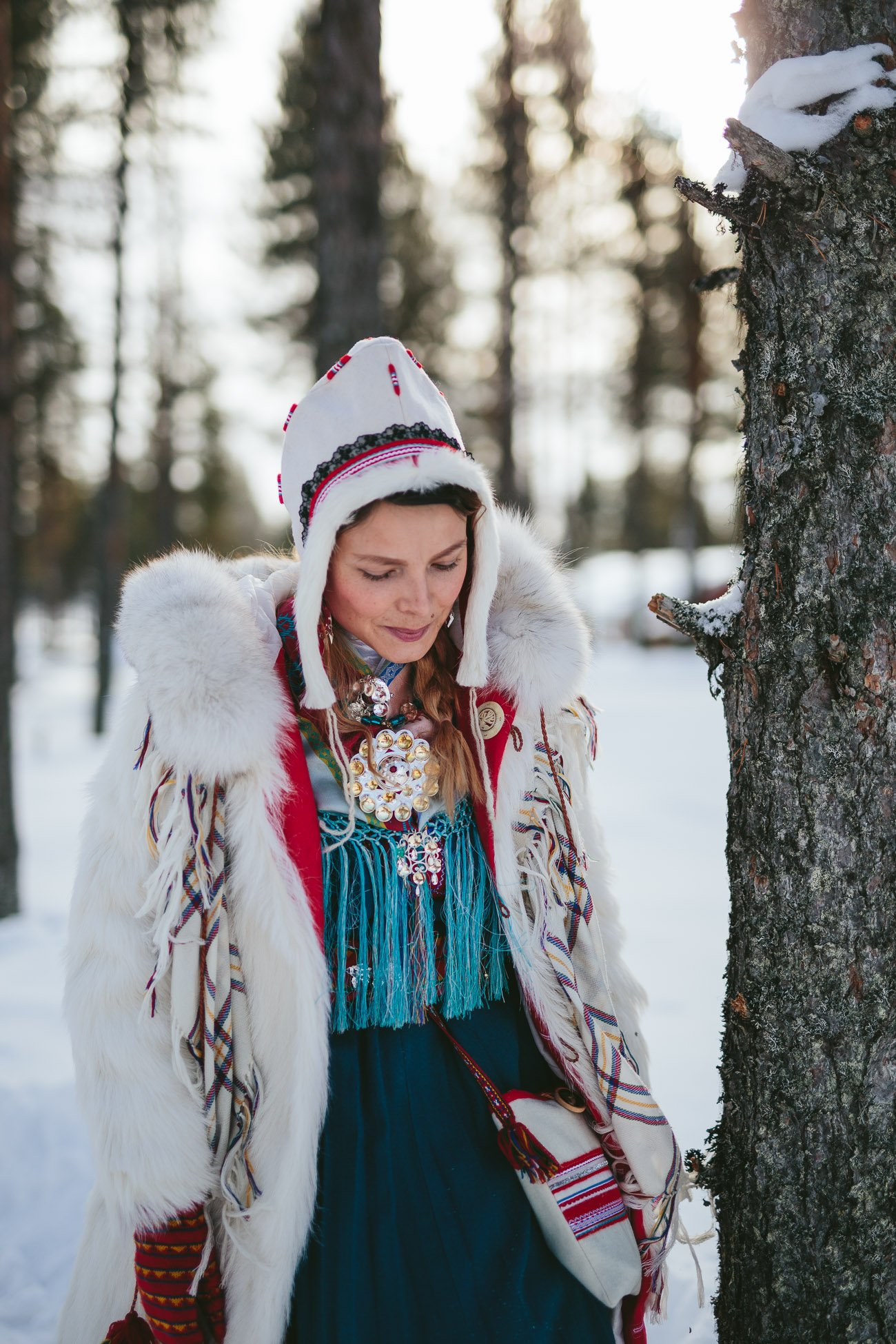 Sami girl Anne Kuhmunen and her reindeer in Swedish Lapland